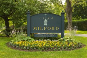 town entrance sign of milford pa surrounded by a garden